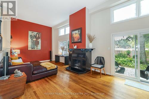 10 - 1755 Rathburn Road E, Mississauga, ON - Indoor Photo Showing Living Room With Fireplace