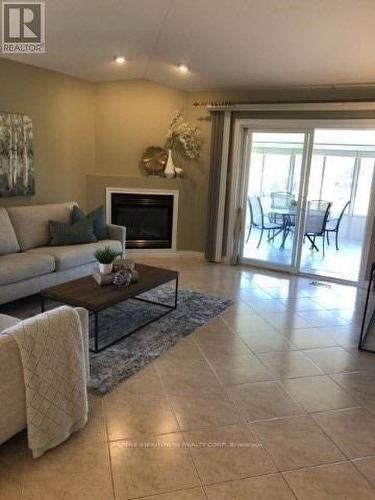 11056 Firgrove Drive, Windsor, ON - Indoor Photo Showing Living Room With Fireplace