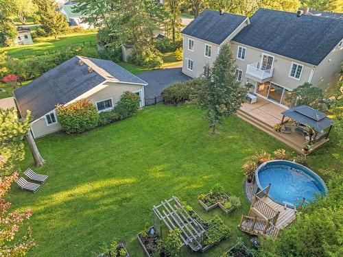 Backyard - 1824 Rue Bachand, Carignan, QC - Outdoor With Above Ground Pool