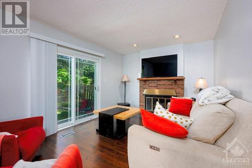 1707 Boisbriand Crescent, Ottawa, ON - Indoor Photo Showing Living Room With Fireplace