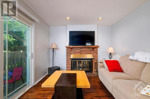 1707 Boisbriand Crescent, Ottawa, ON - Indoor Photo Showing Living Room With Fireplace