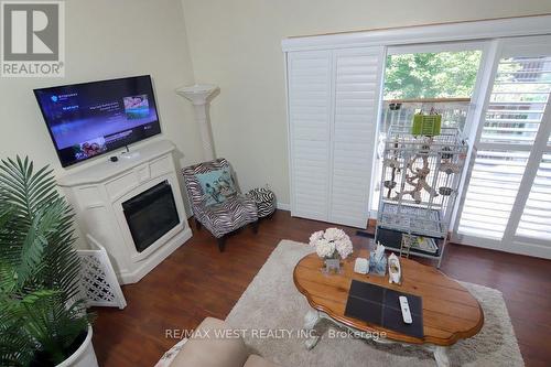 2244 - 2244 Marine Drive, Oakville, ON - Indoor Photo Showing Living Room With Fireplace