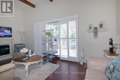 2244 - 2244 Marine Drive, Oakville, ON - Indoor Photo Showing Living Room With Fireplace