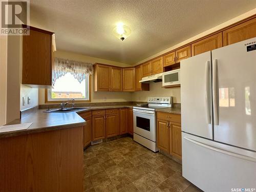 210 6 Lorne Place, Regina, SK - Indoor Photo Showing Kitchen With Double Sink