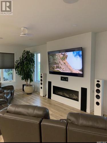 4 Huber Bay, Emerald Park, SK - Indoor Photo Showing Living Room With Fireplace