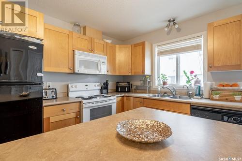 48 2801 Windsor Park Road, Regina, SK - Indoor Photo Showing Kitchen With Double Sink