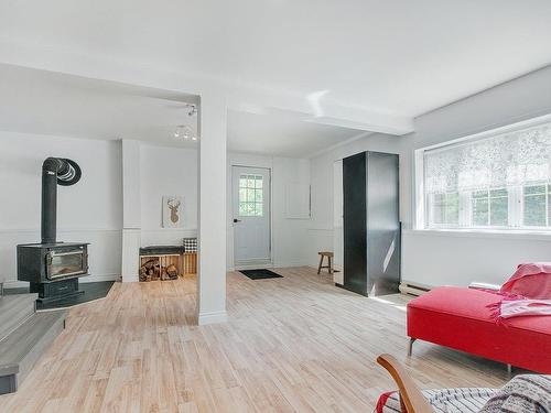 Living room - 5046 Ch. Lendman, Sainte-Agathe-Des-Monts, QC - Indoor With Fireplace