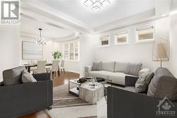 Separate spacious Living Room entertaining guests - Virtually staged - 