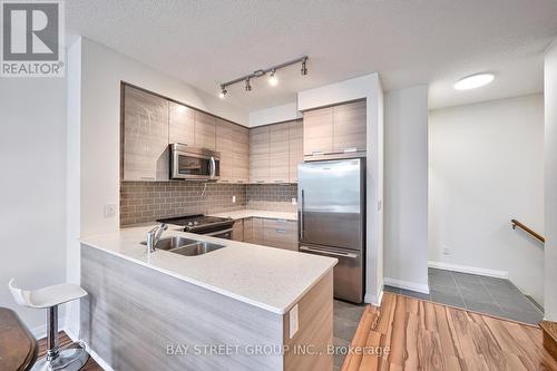 108 - 55 Eglinton Avenue W, Mississauga, ON - Indoor Photo Showing Kitchen With Stainless Steel Kitchen With Double Sink With Upgraded Kitchen