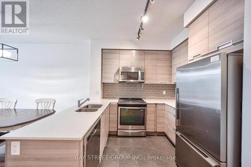 108 - 55 Eglinton Avenue W, Mississauga, ON - Indoor Photo Showing Kitchen With Stainless Steel Kitchen With Double Sink With Upgraded Kitchen