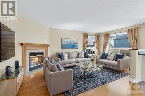 Staged living room - 14 Knowlton Drive, Ottawa, ON - Indoor Photo Showing Living Room With Fireplace