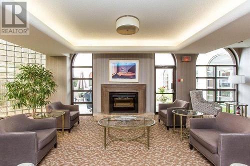 1908 - 1 Aberfoyle Crescent, Toronto, ON - Indoor Photo Showing Living Room With Fireplace