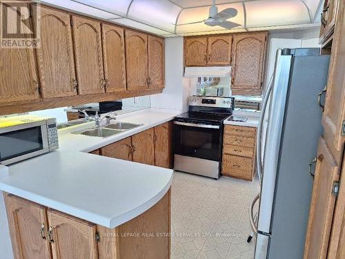 1908 - 1 Aberfoyle Crescent, Toronto, ON - Indoor Photo Showing Kitchen With Double Sink