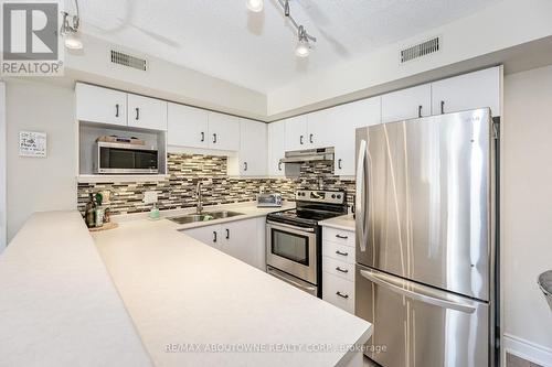 204 - 2010 Cleaver Avenue, Burlington, ON - Indoor Photo Showing Kitchen With Stainless Steel Kitchen With Double Sink With Upgraded Kitchen