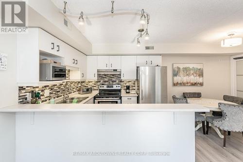 204 - 2010 Cleaver Avenue, Burlington, ON - Indoor Photo Showing Kitchen With Stainless Steel Kitchen With Double Sink With Upgraded Kitchen