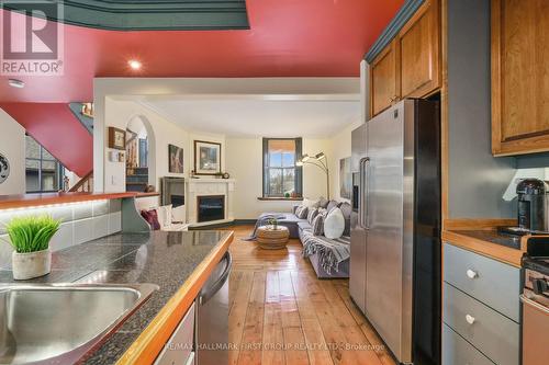 2 - 18 Chapel Street, Cobourg, ON - Indoor Photo Showing Kitchen With Fireplace