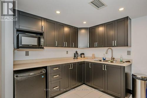 104 - 1071 Queens Avenue, Oakville, ON - Indoor Photo Showing Kitchen With Double Sink