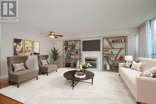 104 - 1071 Queens Avenue, Oakville, ON - Indoor Photo Showing Living Room With Fireplace