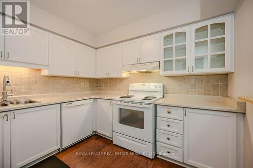 104 - 1071 Queens Avenue, Oakville, ON - Indoor Photo Showing Kitchen With Double Sink