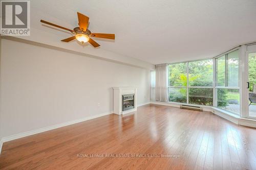 104 - 1071 Queens Avenue, Oakville, ON - Indoor Photo Showing Living Room With Fireplace