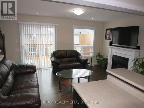 77 Oakes Crescent, Guelph, ON - Indoor Photo Showing Living Room With Fireplace