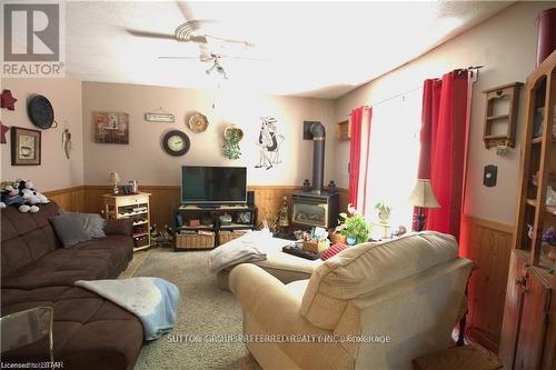 27A Warren Road, Norfolk (Simcoe), ON - Indoor Photo Showing Living Room With Fireplace