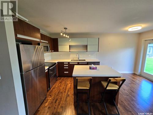 406 1303 Paton Crescent, Saskatoon, SK - Indoor Photo Showing Kitchen With Stainless Steel Kitchen With Double Sink