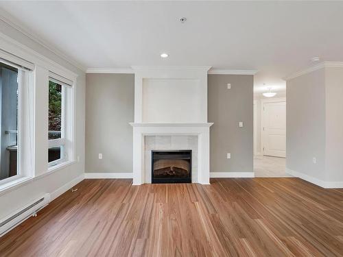 202-535 Heatherdale Lane, Saanich, BC - Indoor Photo Showing Living Room With Fireplace