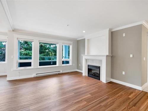 202-535 Heatherdale Lane, Saanich, BC - Indoor Photo Showing Living Room With Fireplace