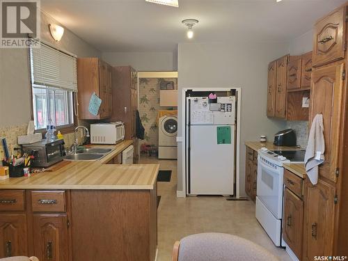 128 3Rd Avenue W, Ponteix, SK - Indoor Photo Showing Kitchen With Double Sink