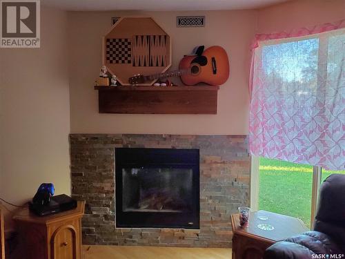 128 3Rd Avenue W, Ponteix, SK - Indoor Photo Showing Living Room With Fireplace