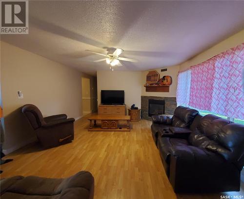 128 3Rd Avenue W, Ponteix, SK - Indoor Photo Showing Living Room With Fireplace