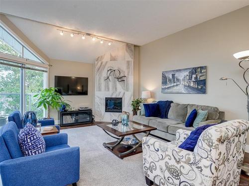 318-10459 Resthaven Dr, Sidney, BC - Indoor Photo Showing Living Room With Fireplace