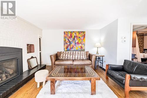 1002 Ontario Street, Cobourg, ON - Indoor Photo Showing Living Room With Fireplace