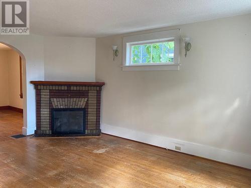 1345 Thom  Street, Trail, BC - Indoor Photo Showing Living Room With Fireplace