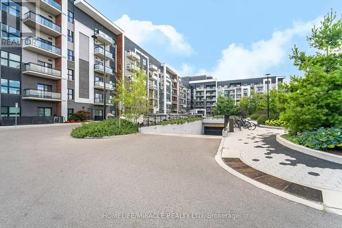 625 - 128 Grovewood Common, Oakville, ON - Outdoor With Balcony With Facade