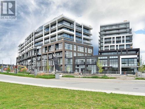 520 - 60 George Butchart Drive, Toronto, ON - Outdoor With Balcony With Facade