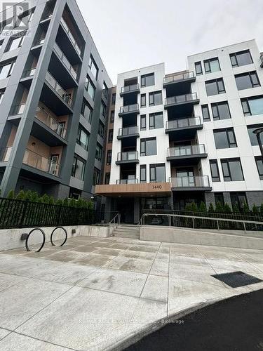 218 - 1440 Clarriage Court, Milton, ON - Outdoor With Balcony With Facade