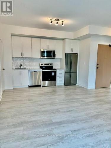 218 - 1440 Clarriage Court, Milton, ON - Indoor Photo Showing Kitchen With Stainless Steel Kitchen