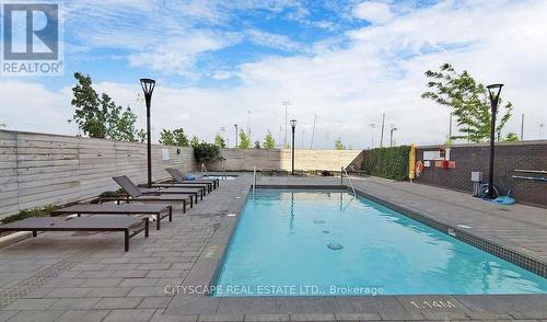 312 - 1050 Main Street E, Milton, ON - Outdoor With In Ground Pool