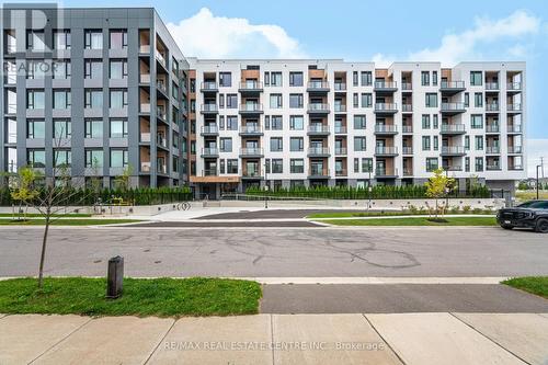 213 - 1440 Clarriage Court, Milton, ON - Outdoor With Facade