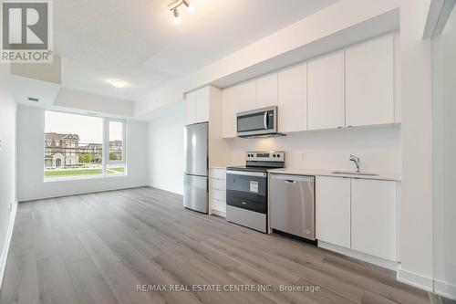 213 - 1440 Clarriage Court, Milton, ON - Indoor Photo Showing Kitchen With Stainless Steel Kitchen