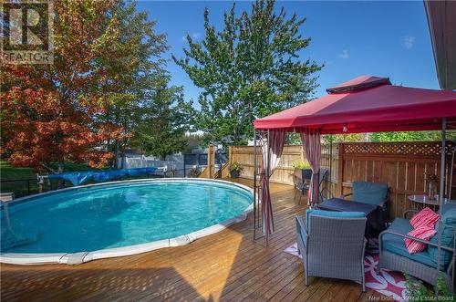 24 Alberta Court, Dieppe, NB - Outdoor With Above Ground Pool With Deck Patio Veranda