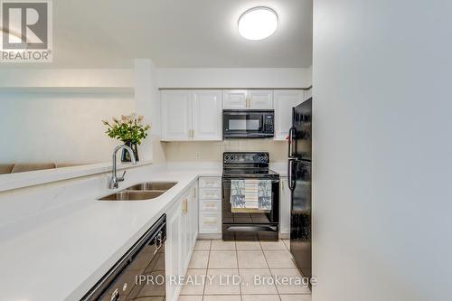 506 - 7 Michael Power Place, Toronto, ON - Indoor Photo Showing Kitchen With Double Sink