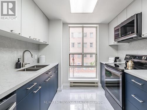 301 - 80 Charles Street E, Toronto, ON - Indoor Photo Showing Kitchen With Double Sink