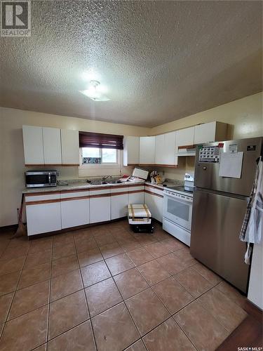 703 3Rd Street E, Meadow Lake, SK - Indoor Photo Showing Kitchen With Double Sink