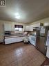 703 3Rd Street E, Meadow Lake, SK  - Indoor Photo Showing Kitchen With Double Sink 