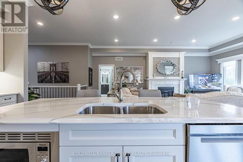 1580 Moe Norman Place, London, ON - Indoor Photo Showing Kitchen With Fireplace With Double Sink