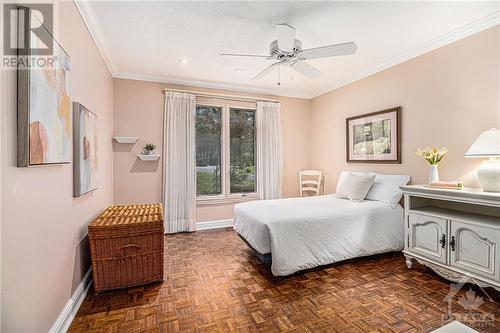 Secondary bedroom overlooks the expansive frontage of the home with mature trees - 7 Lockview Road, Ottawa, ON - Indoor Photo Showing Bedroom