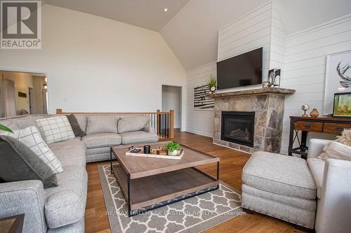 115 Hall Drive, Galway-Cavendish And Harvey, ON - Indoor Photo Showing Living Room With Fireplace